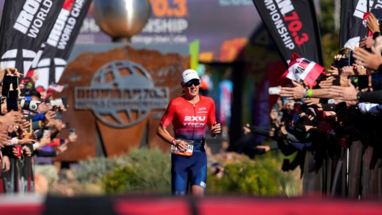 ST GEORGE, UTAH - OCTOBER 28: Taylor Knibb of the United States finishes in in first place during the IRONMAN 70.3 World Championship on October 28, 2022 in St George, Utah. (Photo by Patrick McDermott/Getty Images for IRONMAN)