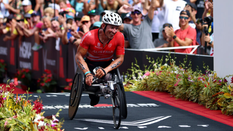 KAILUA KONA, HAWAII - OCTOBER 06: Thomas Fruhwirth of Austria celebrates winning his category during the Ironman World Championships on October 06, 2022 in Kailua Kona, Hawaii. (Photo by Katelyn Mulcahy/Getty Images for IRONMAN)