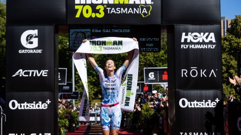 Ellie Salthouse crosses the line first at IRONMAN 703 Tasmania photo credit Korupt Vision