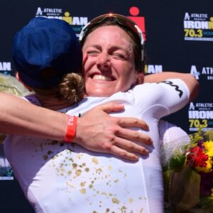 Kat Matthews Oceanside Chelsea Sodaro hug [Photo credit: Donald Miralle for IRONMAN]