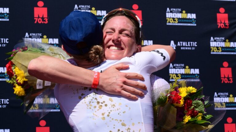 Kat Matthews Oceanside Chelsea Sodaro hug [Photo credit: Donald Miralle for IRONMAN]