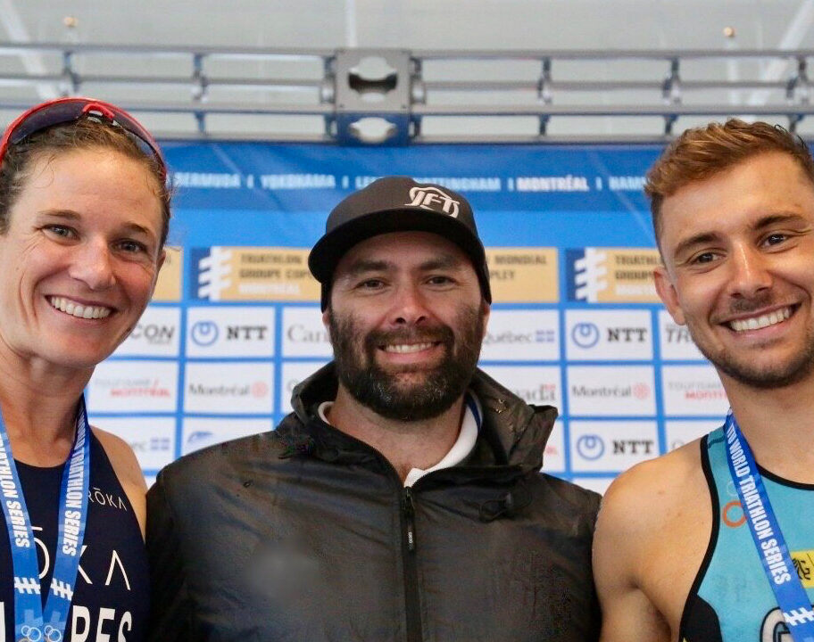 Joel Filliol with athletes Katie Zaferes and Belle Geens.