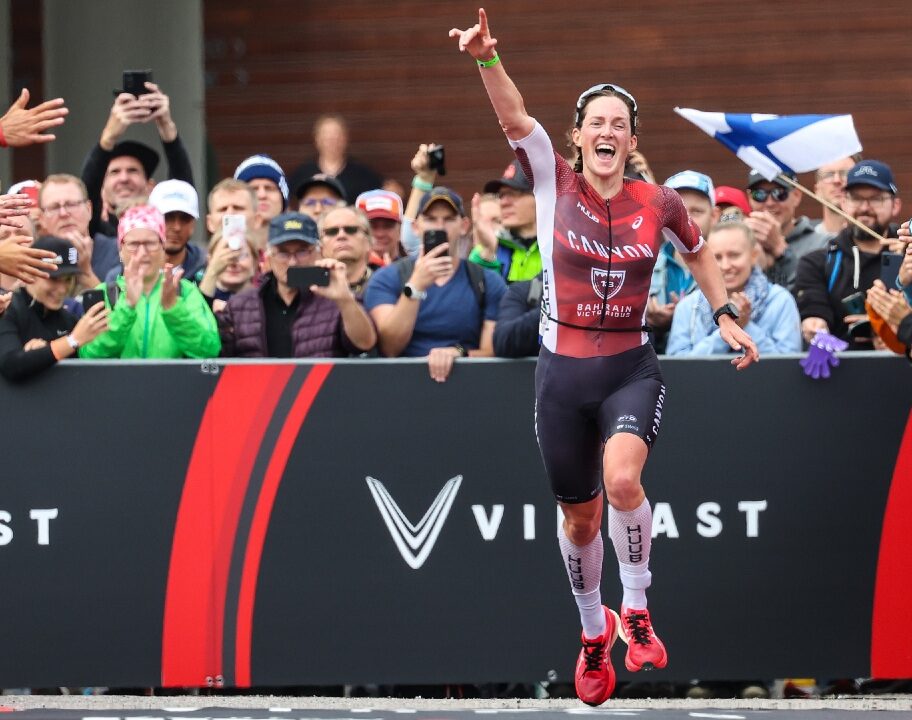 Kat Matthews runs down the red carpet to second place (Photo by Nigel Roddis, Getty Images for IRONMAN)