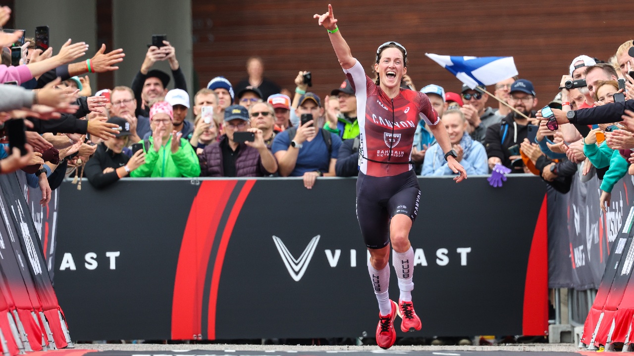 Kat Matthews runs down the red carpet to second place (Photo by Nigel Roddis, Getty Images for IRONMAN)