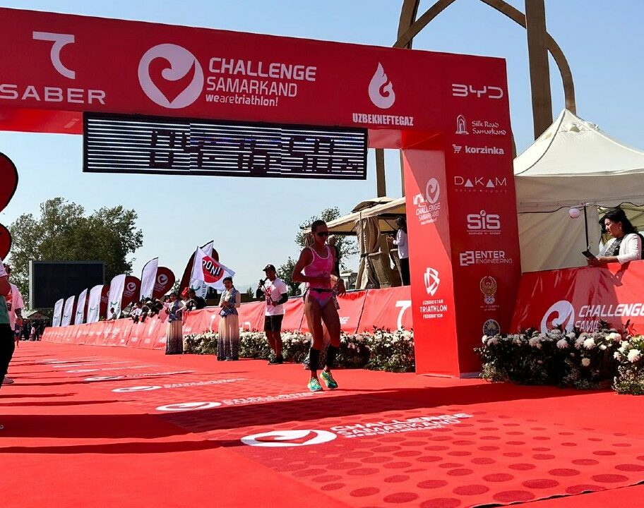 Emma Pallant-Browne crosses the line at Challenge Samarkand photo credit Challenge Family