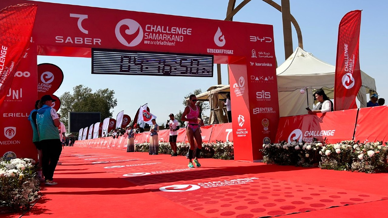 Emma Pallant-Browne crosses the line at Challenge Samarkand photo credit Challenge Family