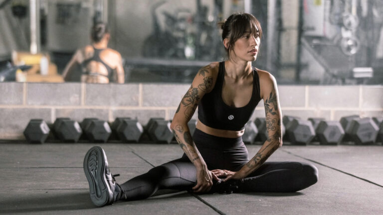 Compression sportswear being used for recovery post-exercise.