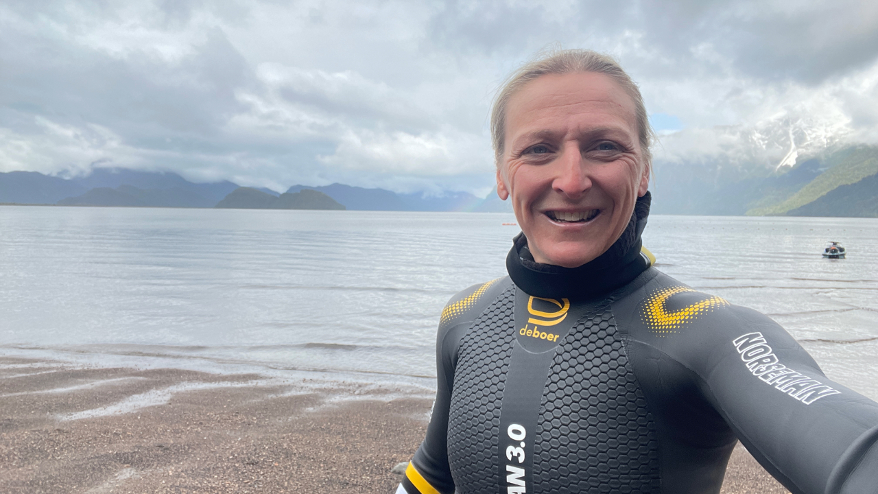 Laura Siddall cold water swim training in Patagonia to prepare for Patagonman.