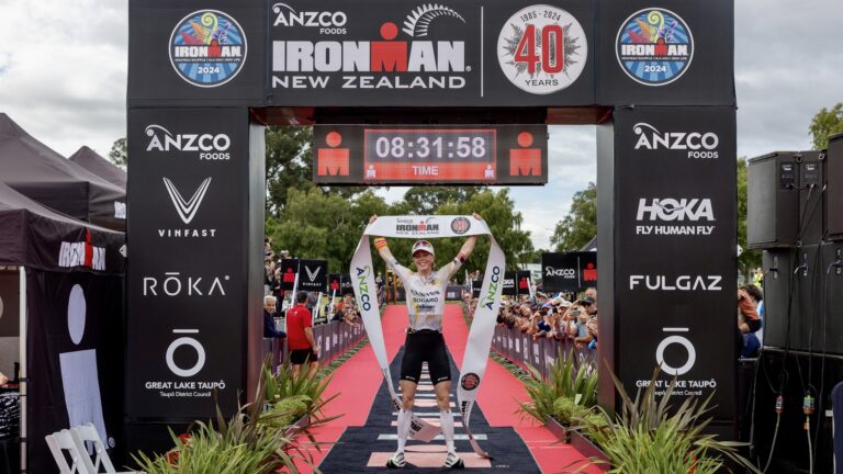 Chelsea Sodaro takes the tape at the 2024 IRONMAN New Zealand.