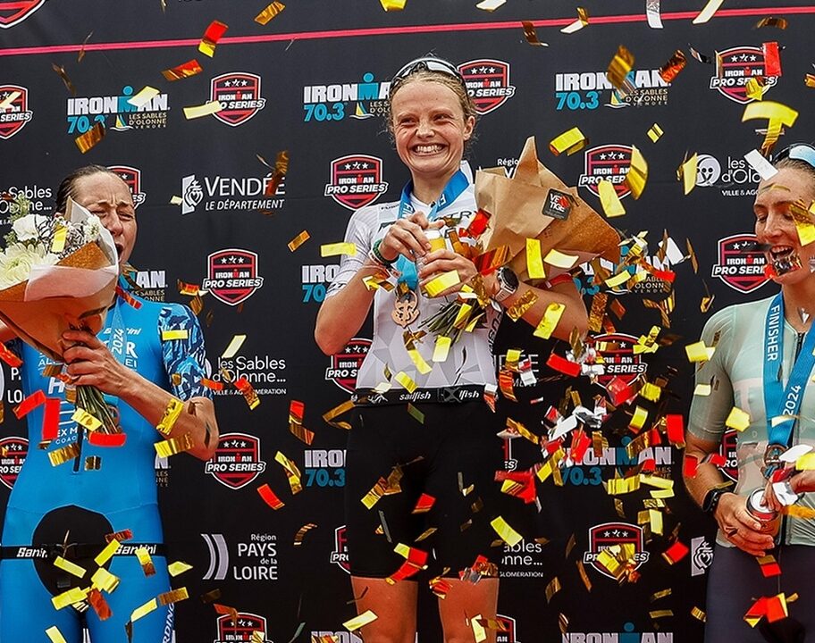 Womens podium IRONMAN 703 Les Sables Bartlett Madsen Curran photo credit IRONMAN