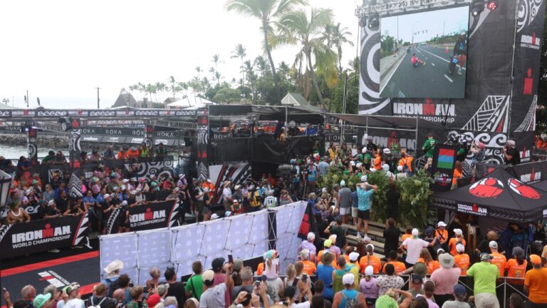 Taylor Knibb sat on road as crowd watch at finish of IRONMAN World Championship Kona 2025