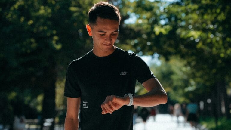 Alex Yee Valencia marathon training looks at COROS watch