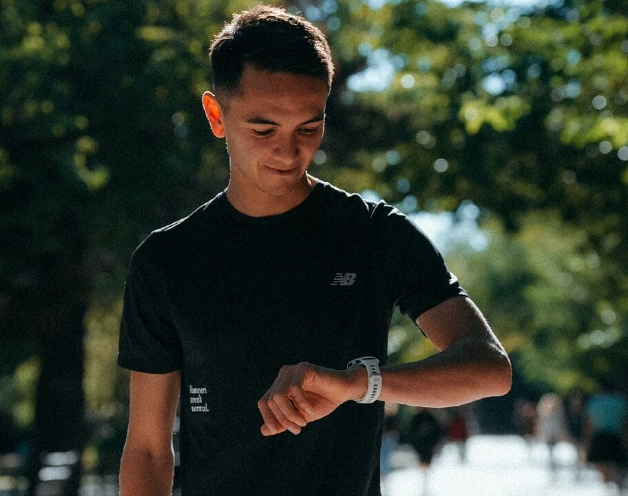 Alex Yee Valencia marathon training looks at COROS watch
