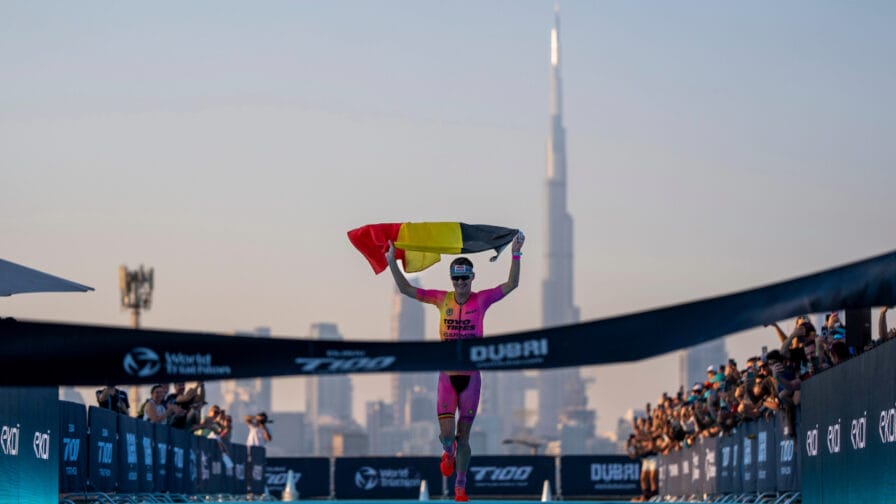 Marten Van Riel of Belgium crosses the line in Dubai to secure the T100 Triathlon Series World Championships.