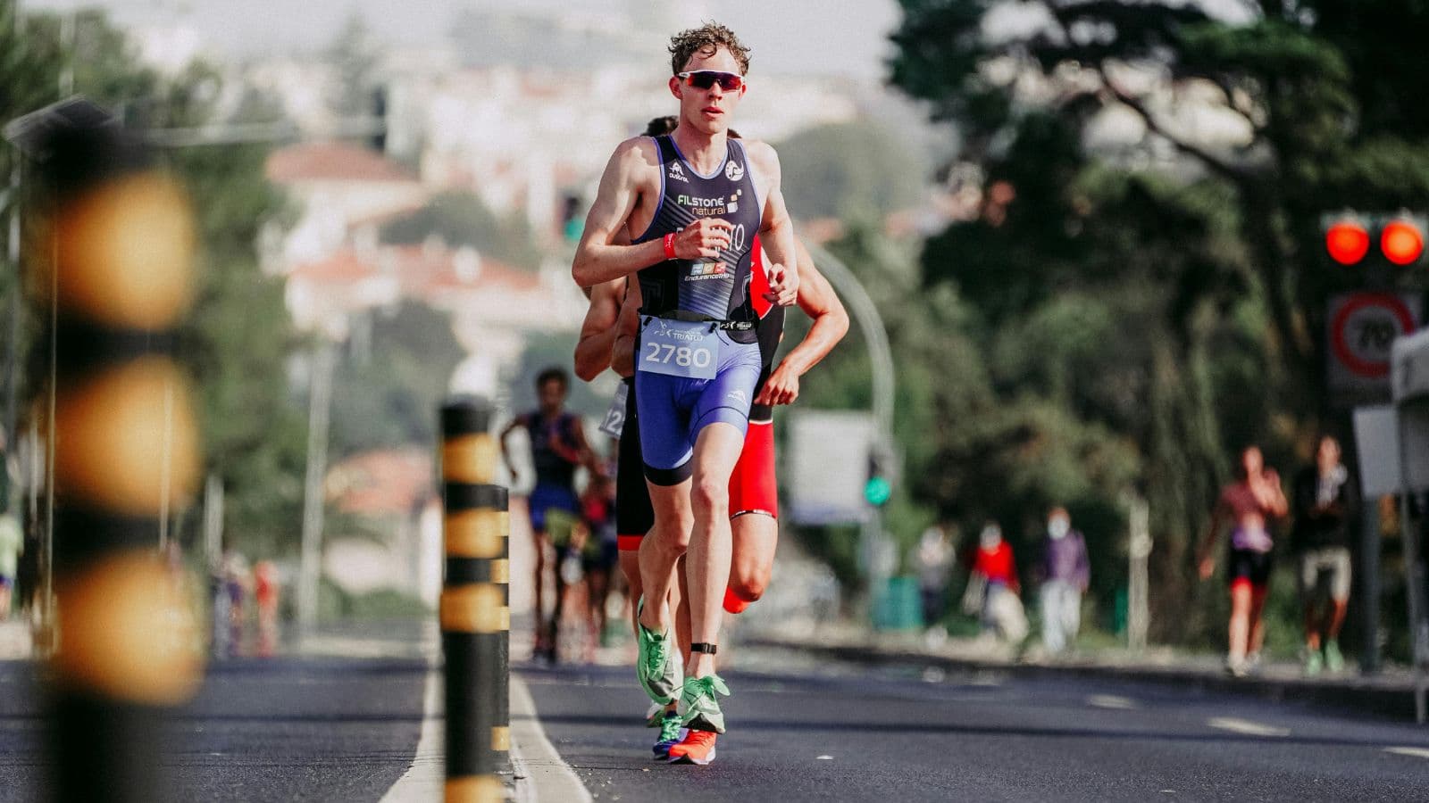 Triathlete completing a run as part of post-training recovery and muscle repair