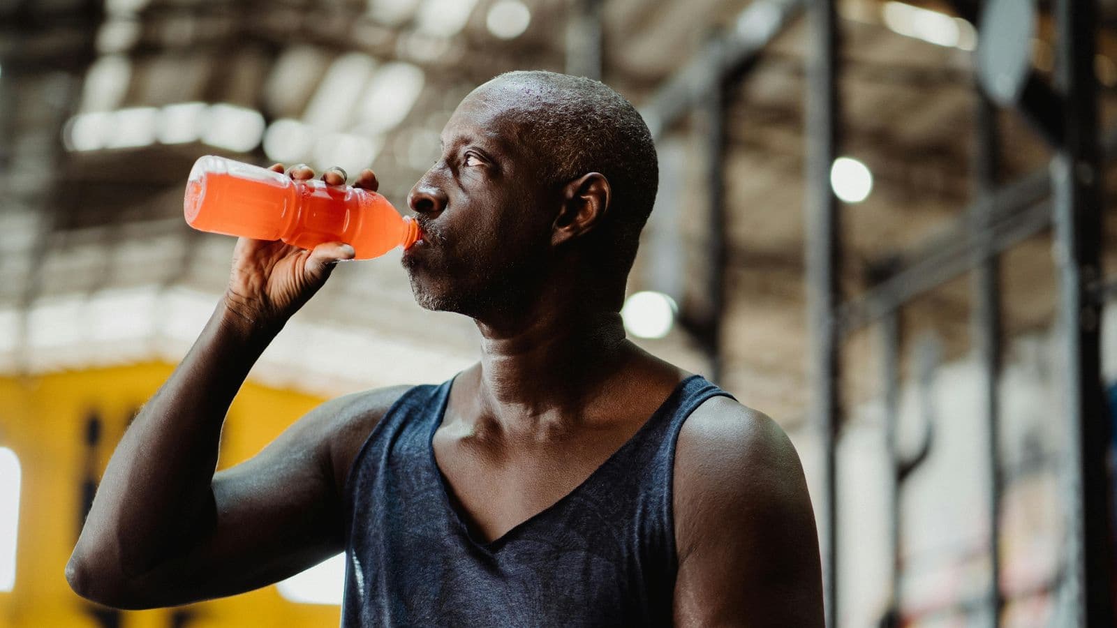 Triathlete consuming electrolytes during race to maintain hydration and sustain energy levels
