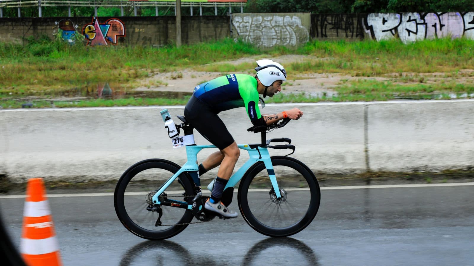 Triathlete cycling during IRONMAN race, maintaining steady power and endurance over long distance