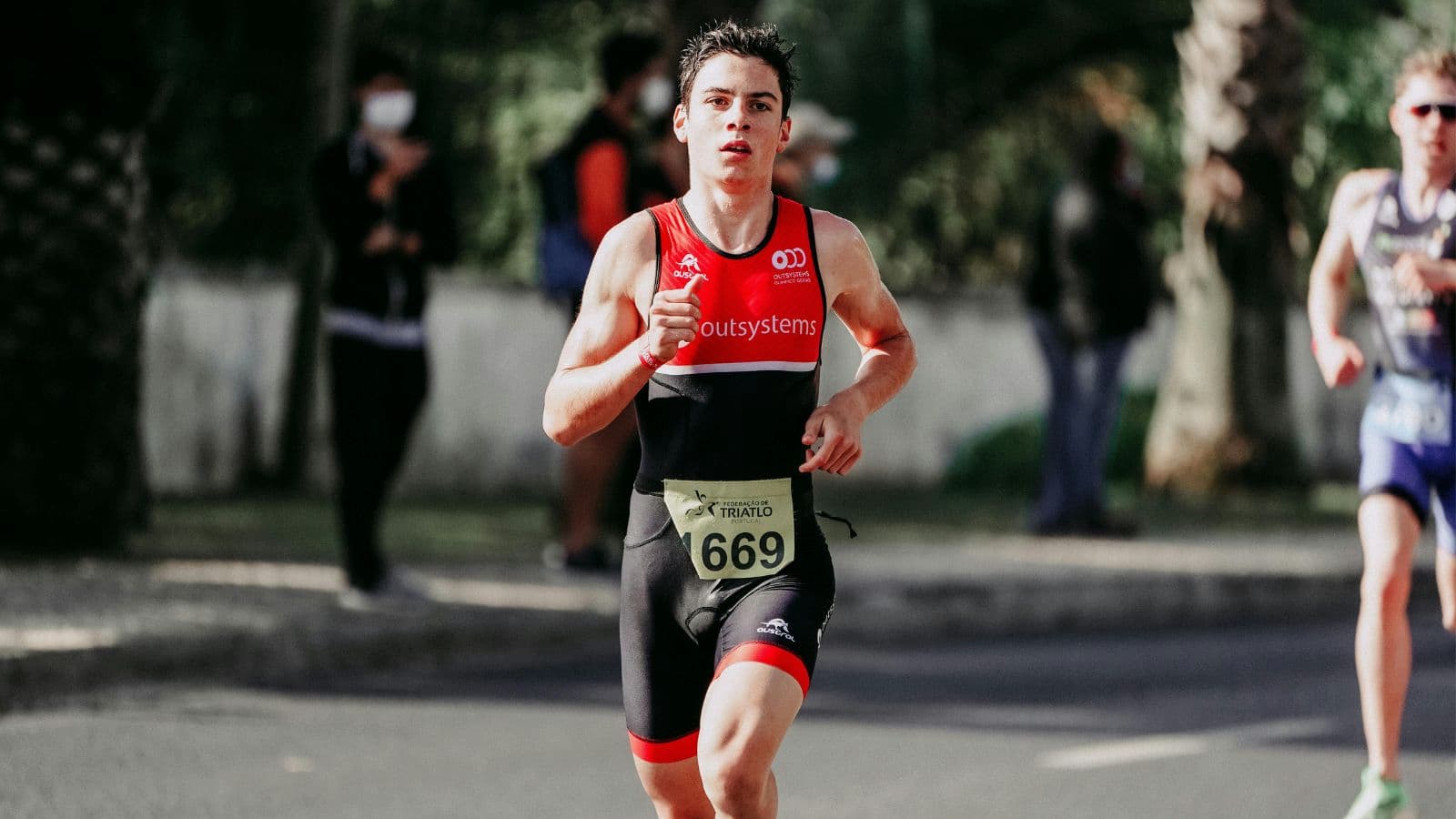 Triathlete running during race with controlled pace and efficient form on final leg