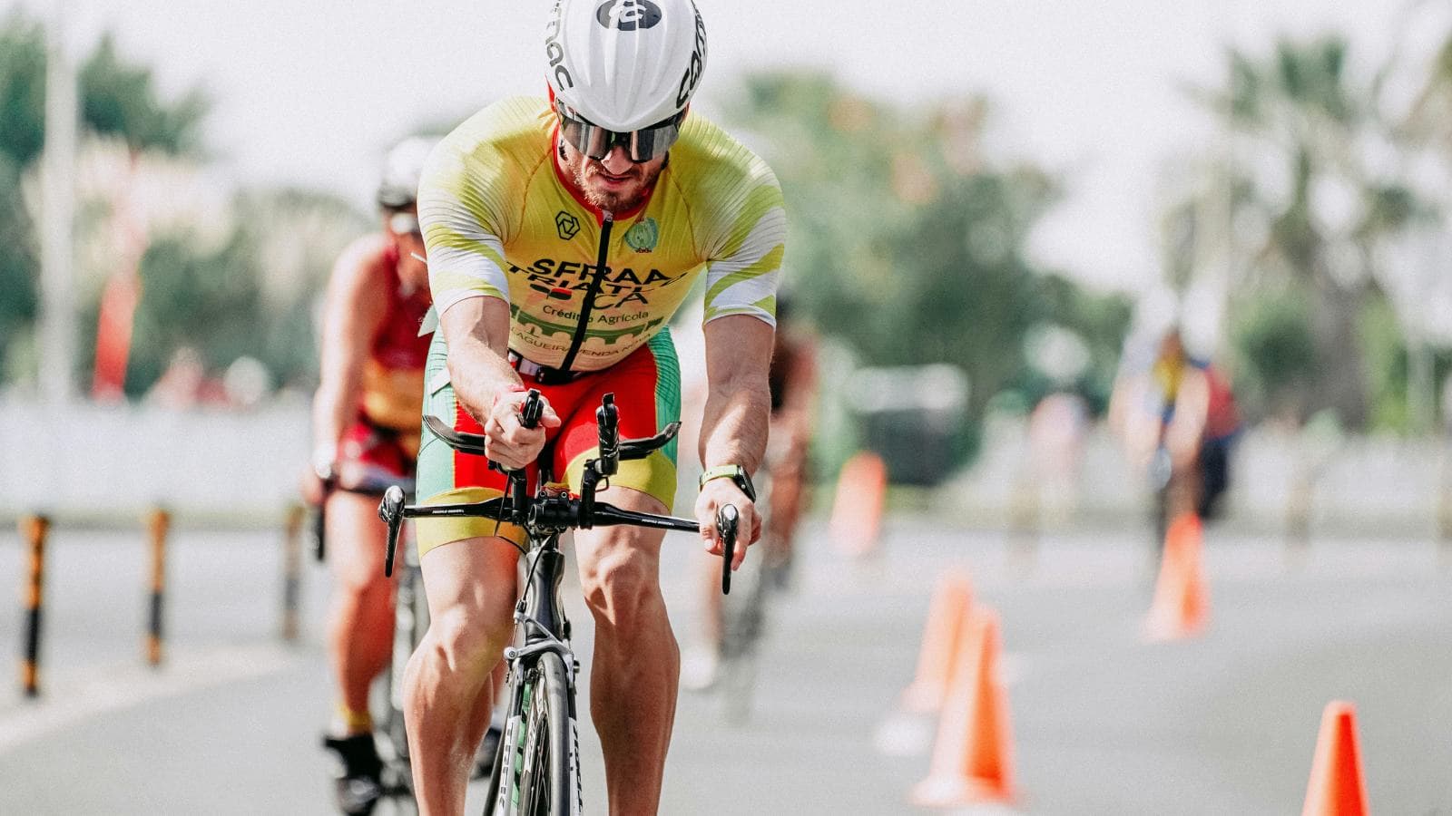 triathlete performing brick workout transitioning from cycling to running for olympic triathlon training