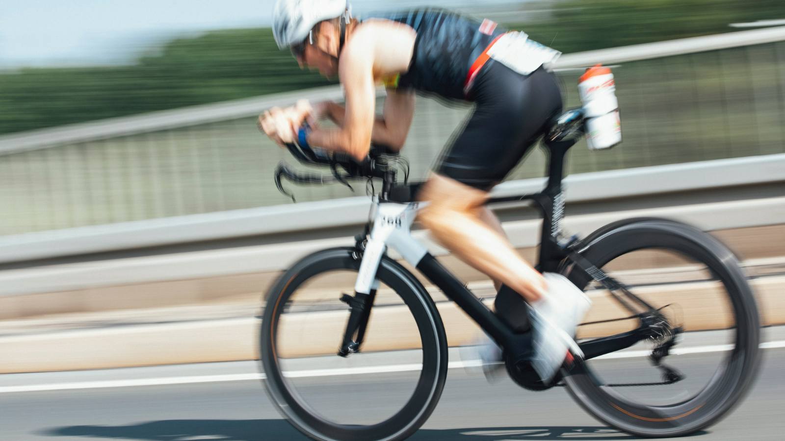Electrolyte bottles mounted on a triathlete’s bike during a race for on-the-go hydration