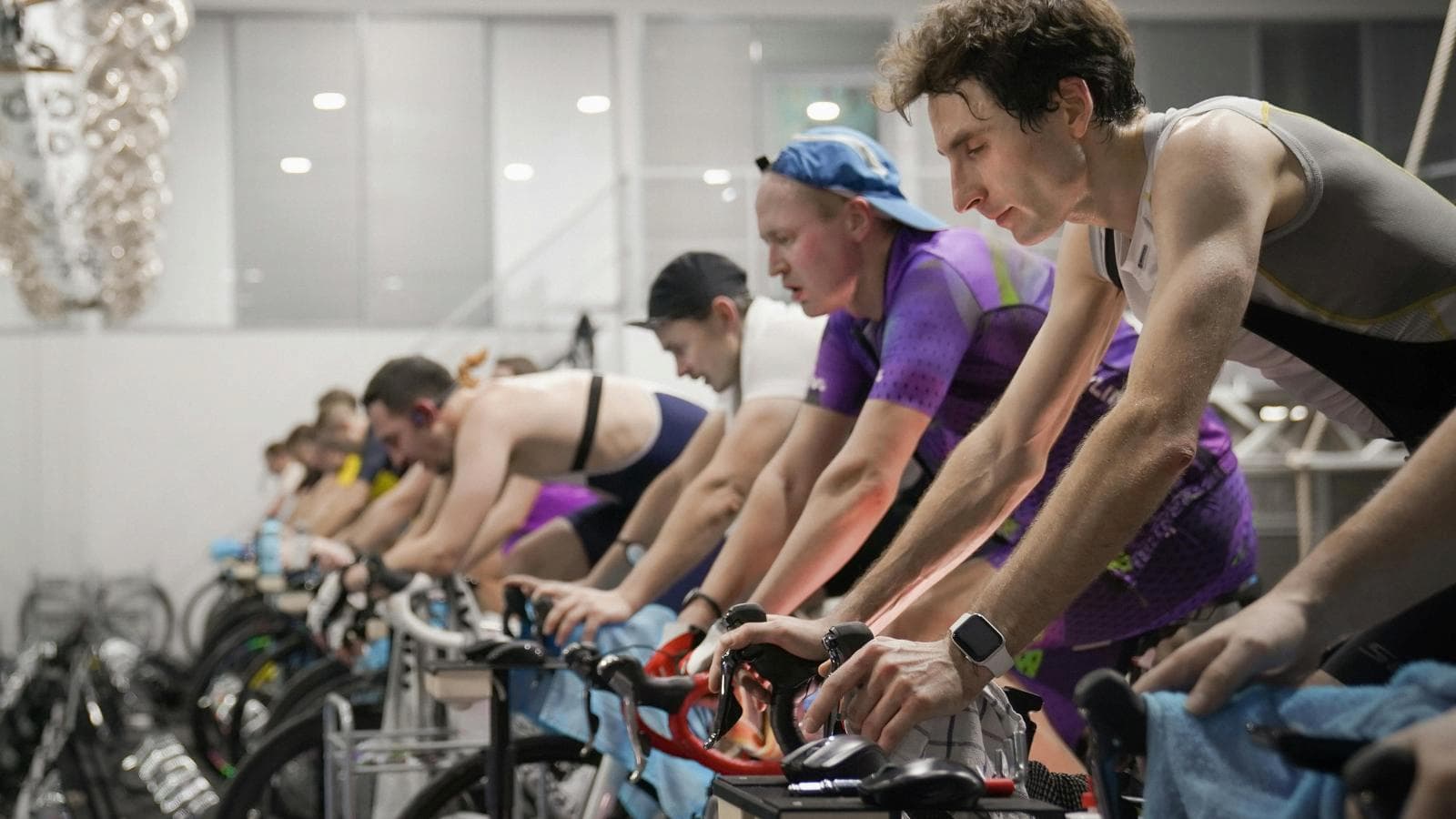 Triathletes training in off season with low intensity workout focusing on recovery and base fitness