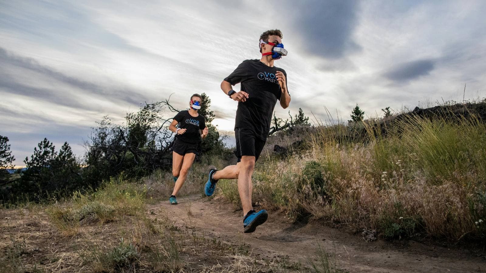 Triathletes running outdoors during endurance training to improve lactate threshold and race performance