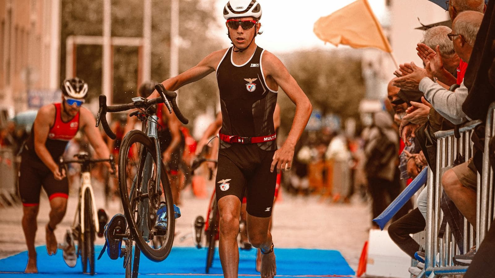 triathlete completing swim bike run workouts as part of weekly olympic triathlon training routine