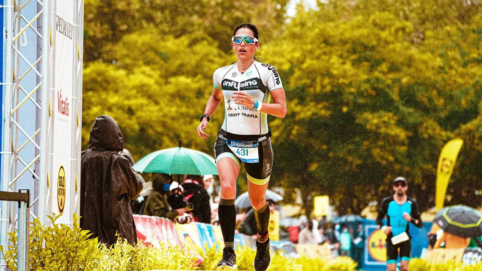 triathlete training for half ironman with swimming cycling and running sessions in structured plan