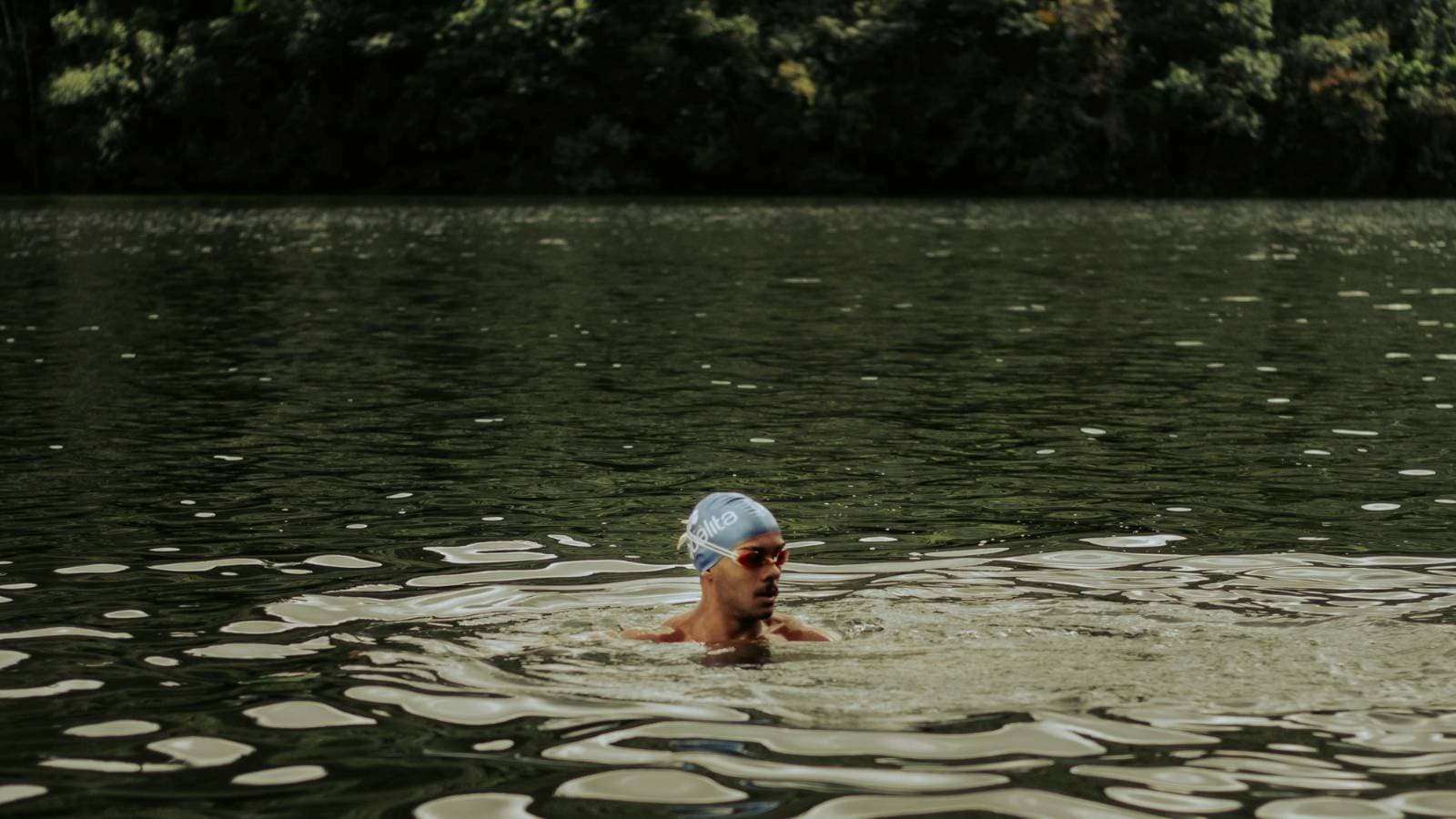 swimmer exiting cold water after training session focusing on safety and gradual acclimation techniques