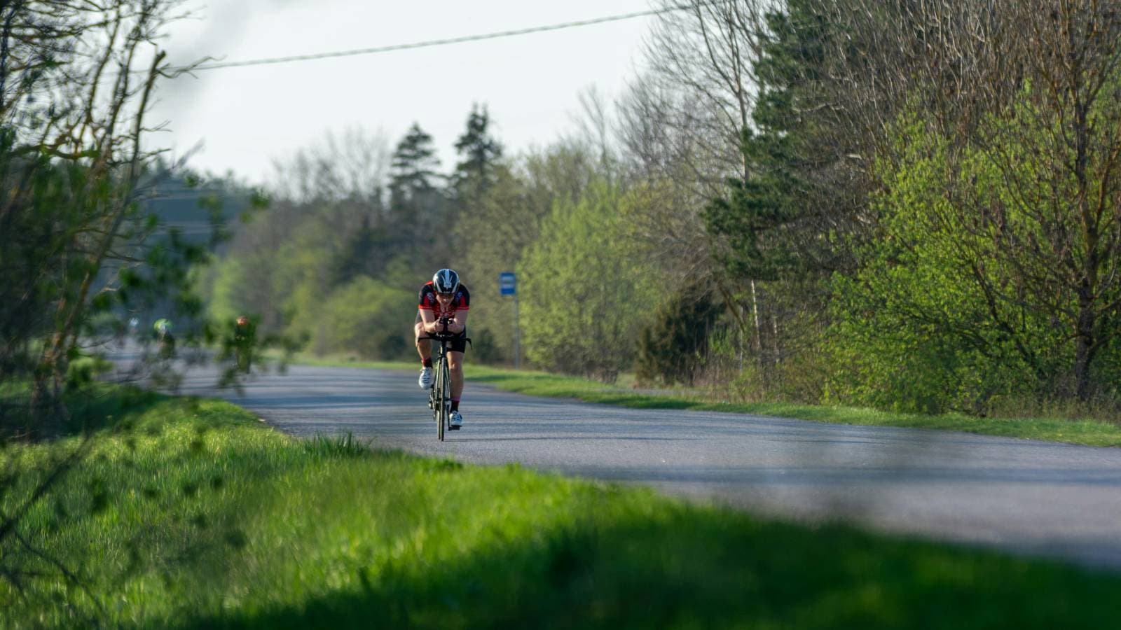 cyclist riding gravel bike on rough terrain practicing skills for gravel triathlon race