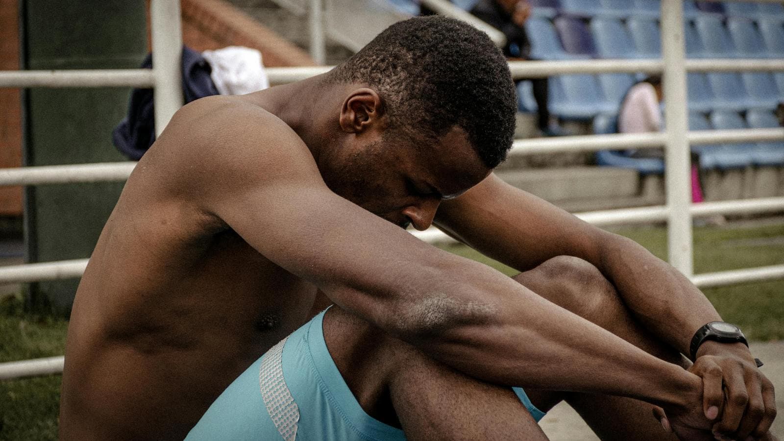 triathlete resting after training session to prevent burnout during ironman preparation