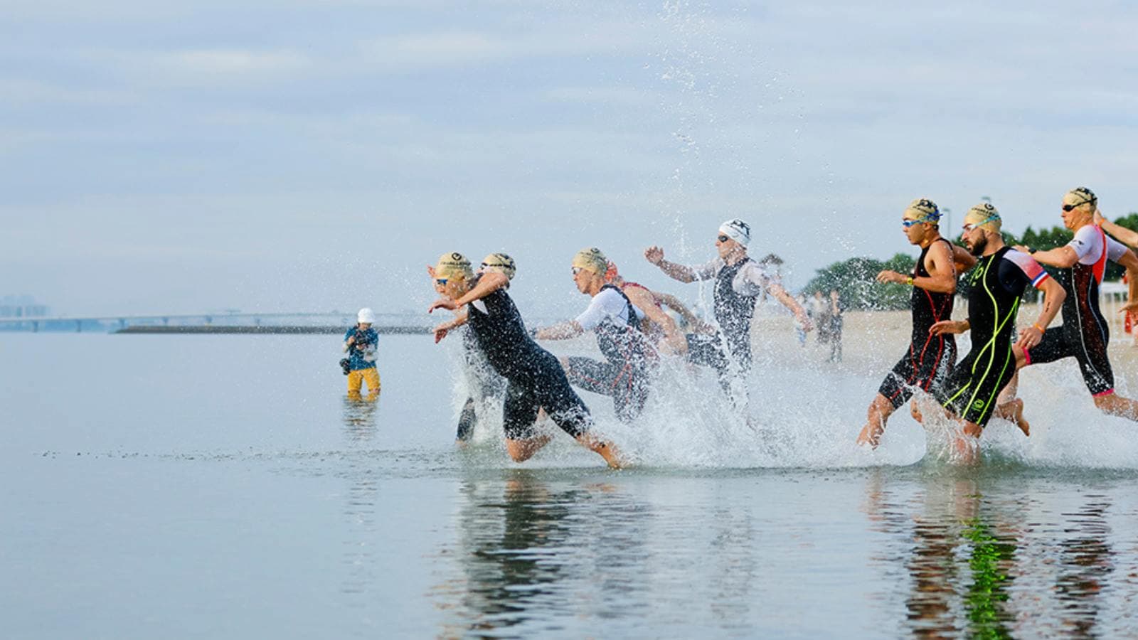 athlete reviewing structured triathlon training schedule for olympic distance race preparation