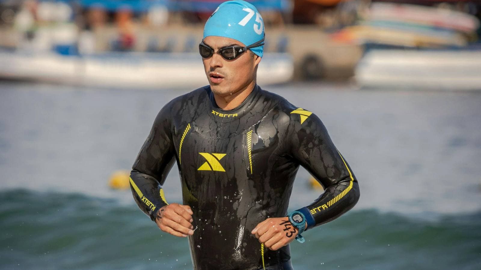 beginner triathlete organizing swim bike and run gear before race to avoid equipment mistakes