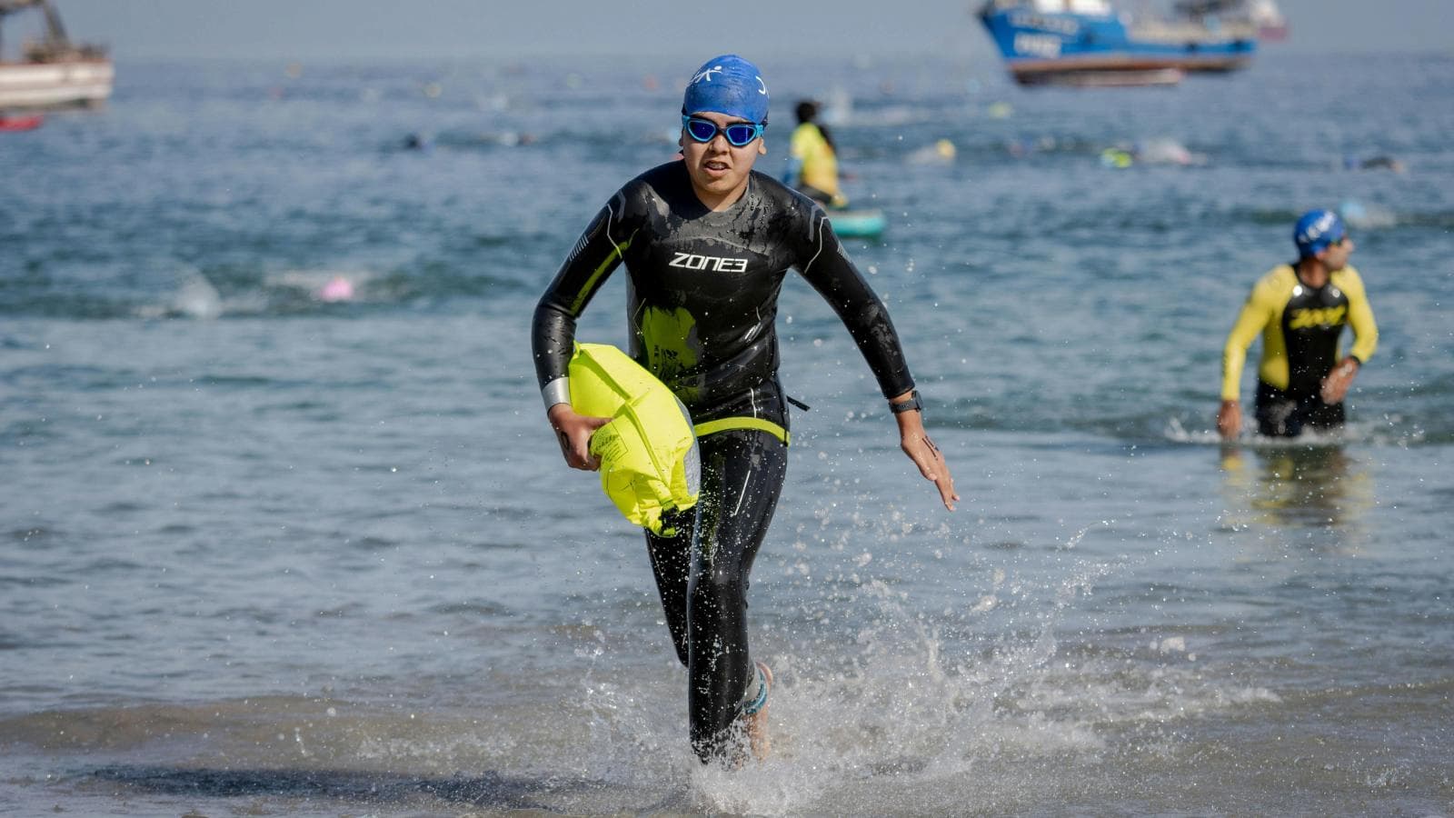 triathlete combining swim bike run workouts with recovery to prevent injury during increased training