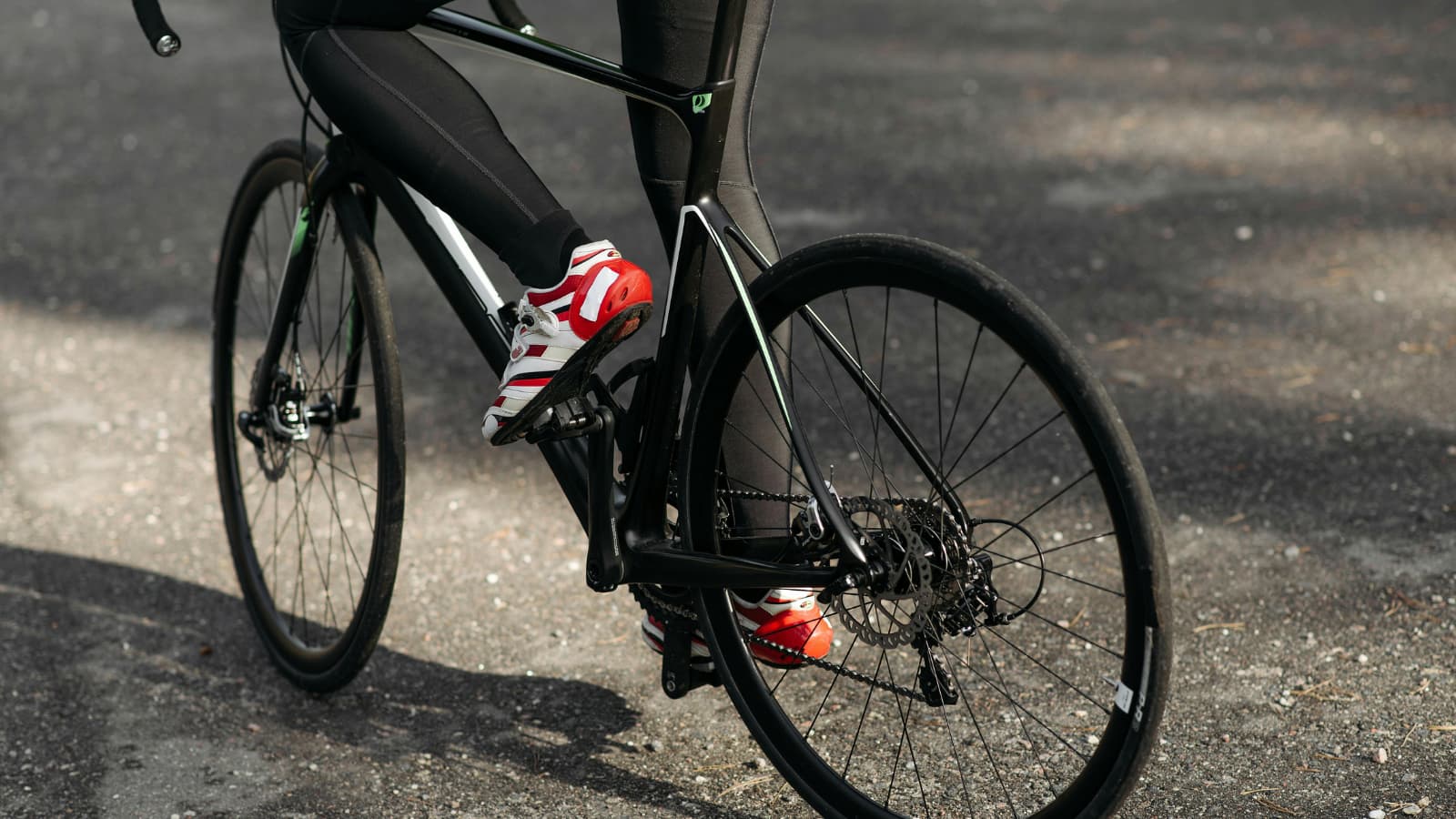 triathlete tuning bike and checking equipment before upcoming race event