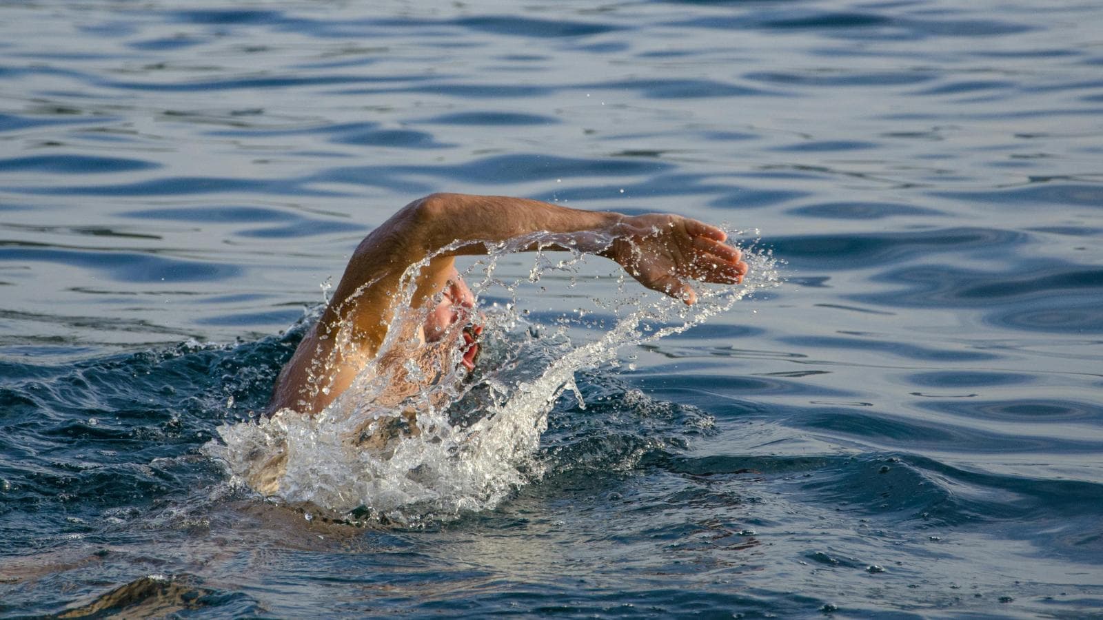 triathlete preparing for cold weather race with thermal gear and safety precautions