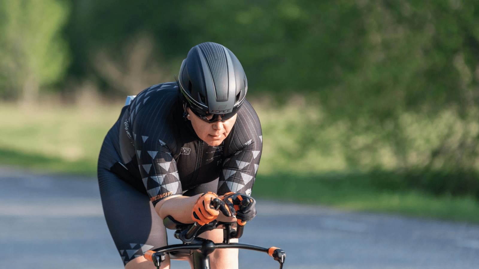 first time triathlete checking bike fit and race equipment before competition