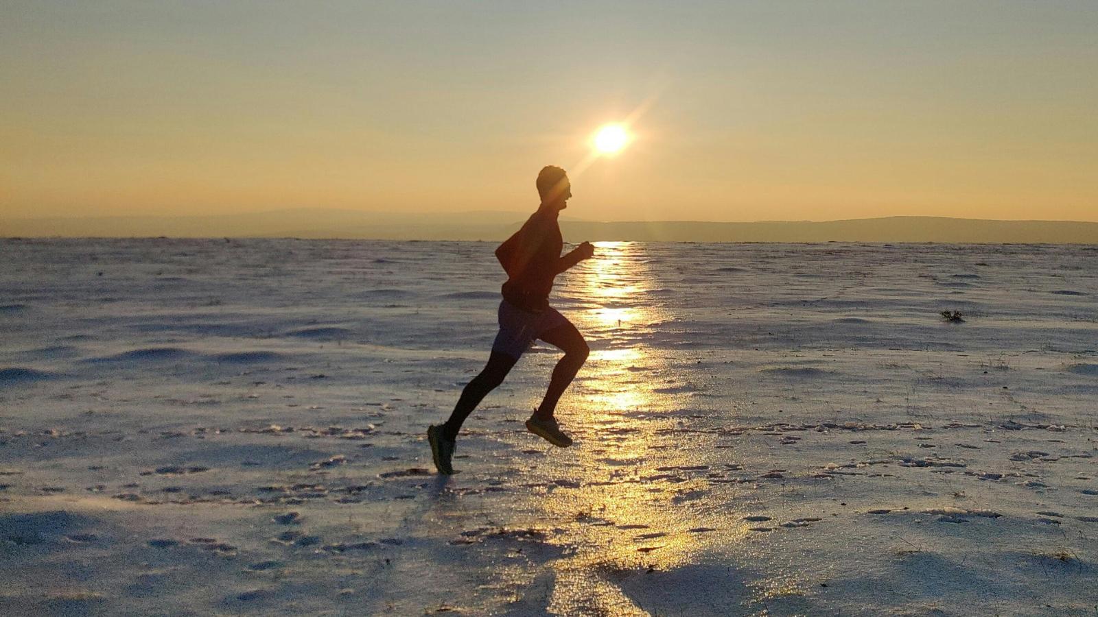 triathlete wearing cold weather gear to prevent hypothermia during race or training