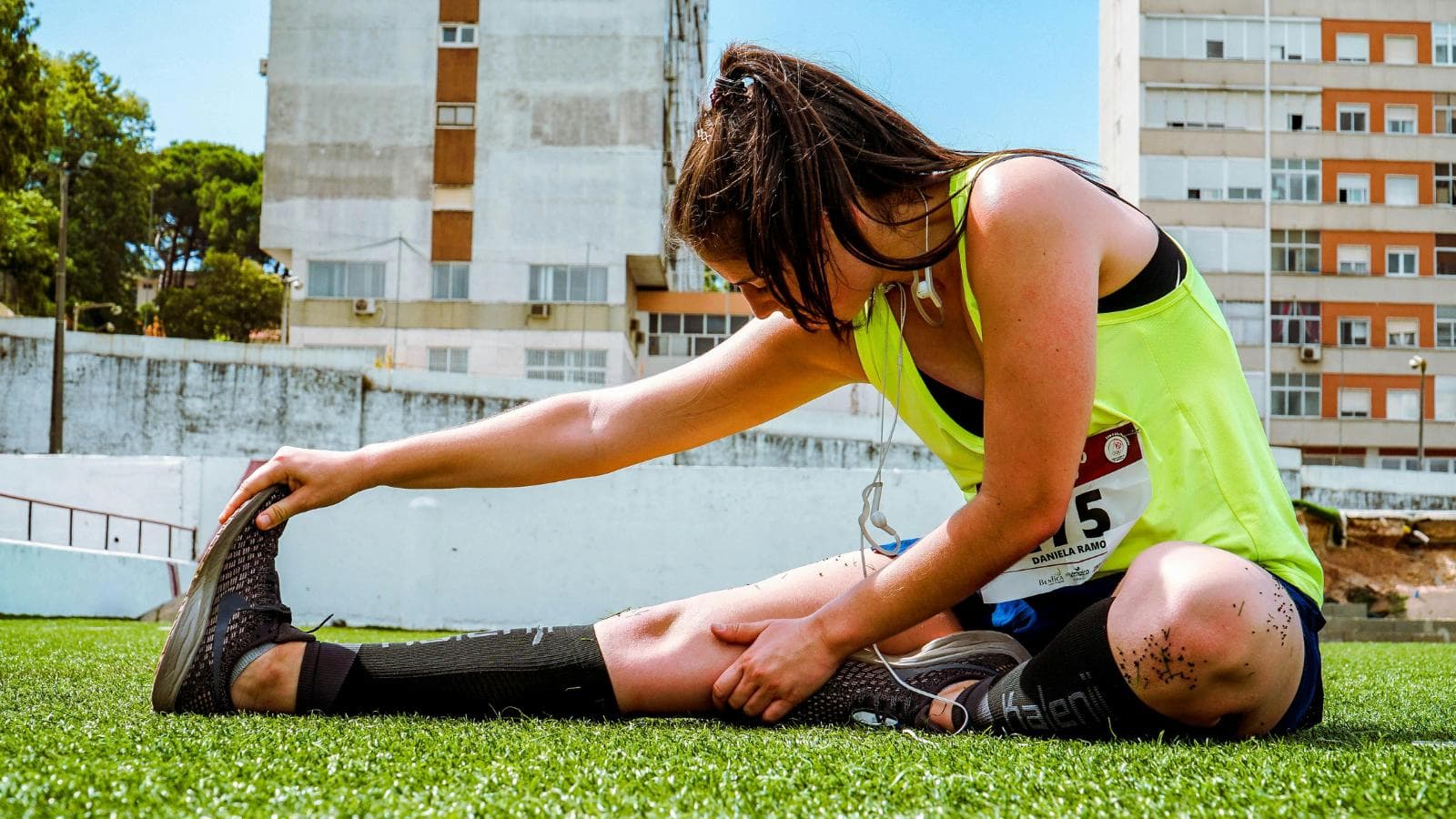 triathlete practicing proper running form and cadence during endurance training session