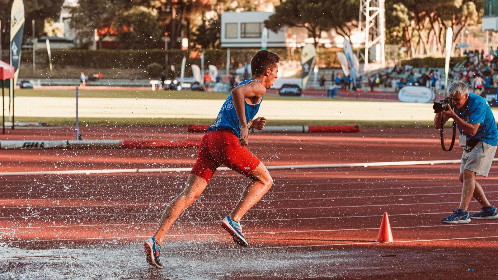 triathlete racing in changing weather conditions with wind rain and varying temperatures during competition