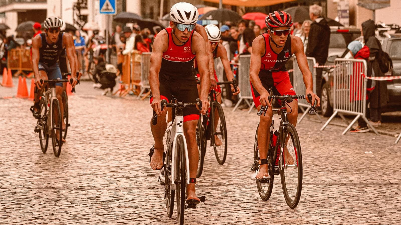 triathletes cycling together during group training ride to improve fitness and motivation