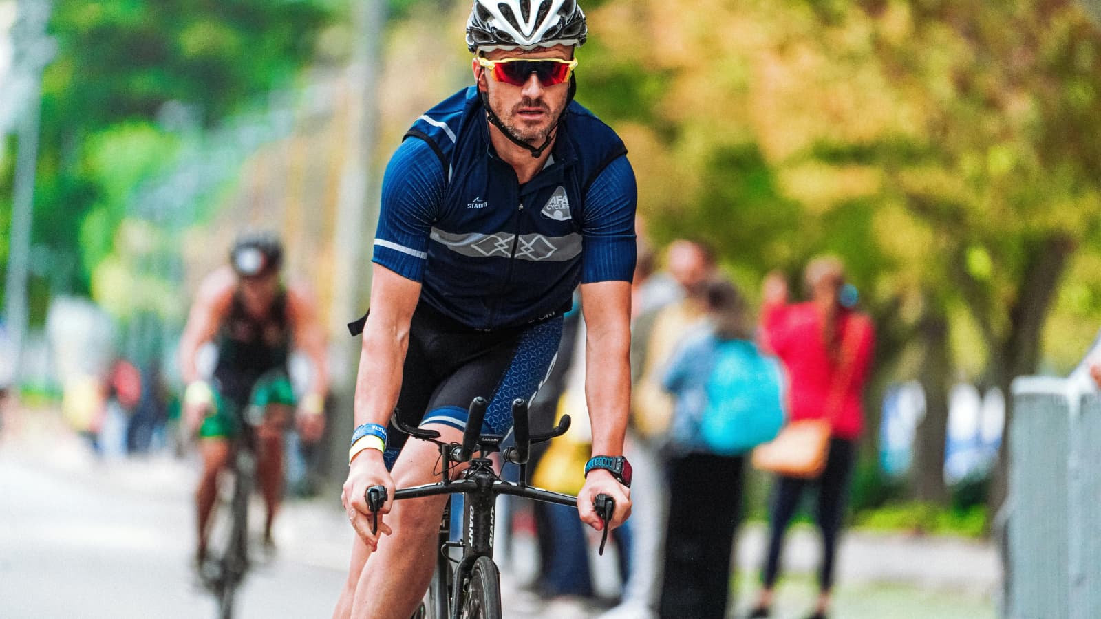 triathlete running off the bike with strong form after maintaining proper cadence and fueling strategy