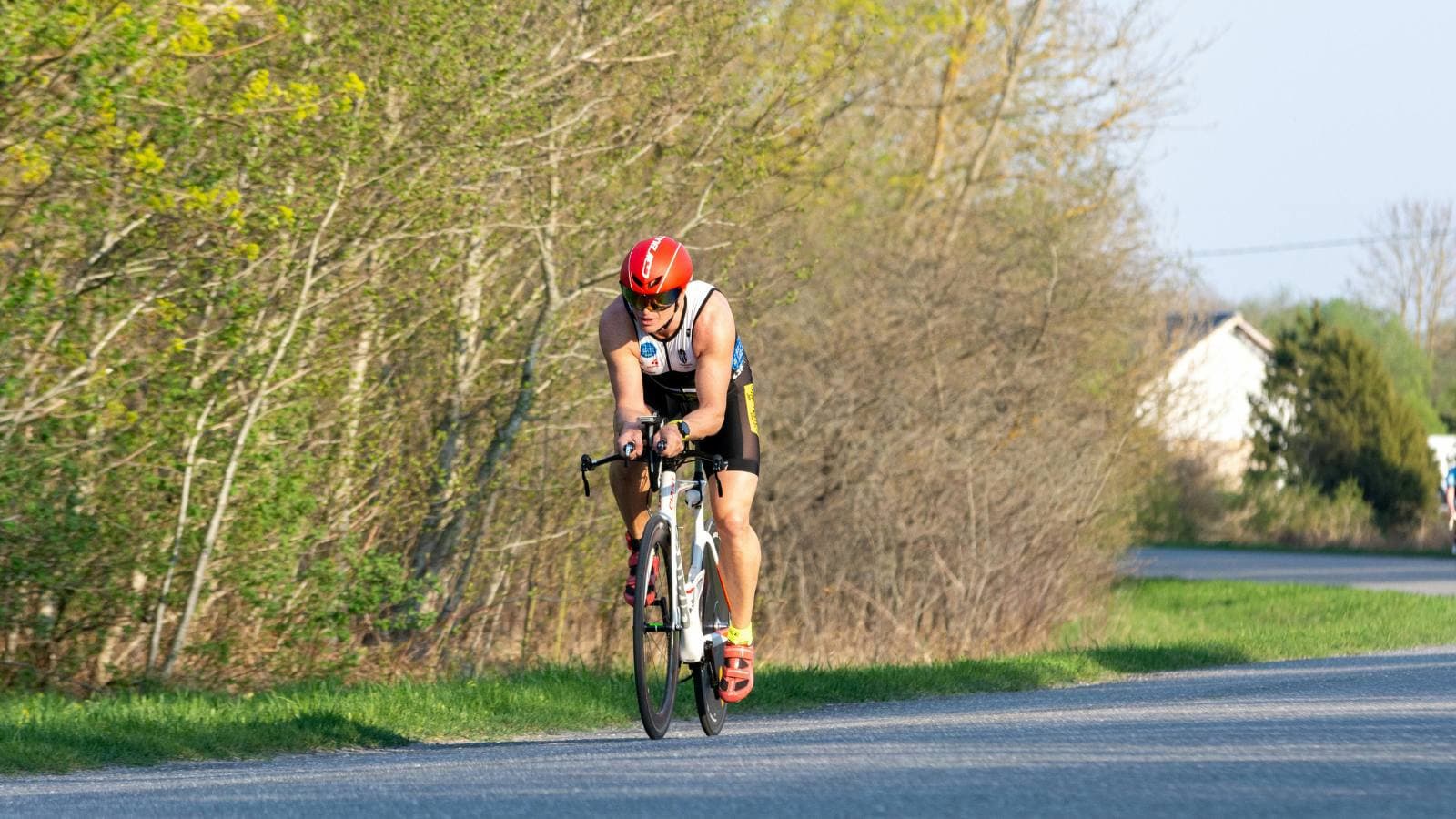 cyclist practicing cornering technique and bike handling skills on road bike