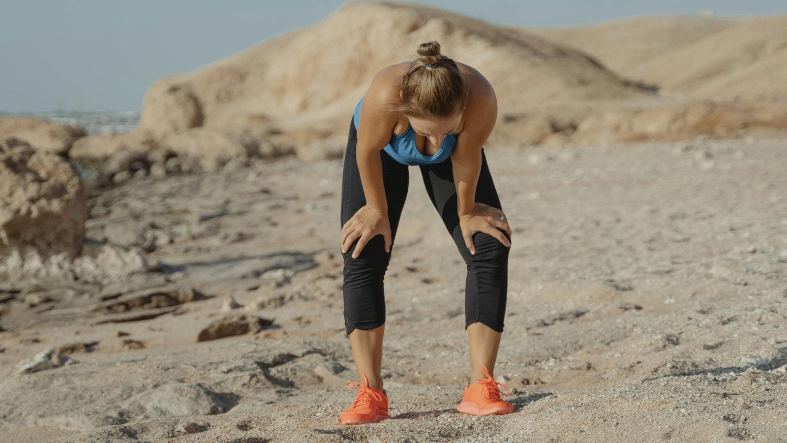 athlete doing endurance workout in warm weather to build heat adaptation and improve performance