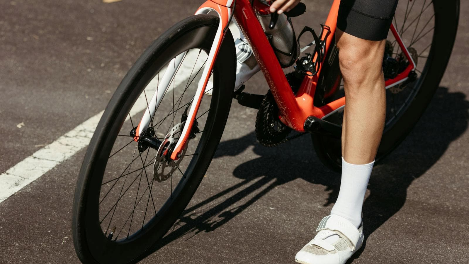 cyclist doing low cadence interval training on hill to enhance climbing strength and performance