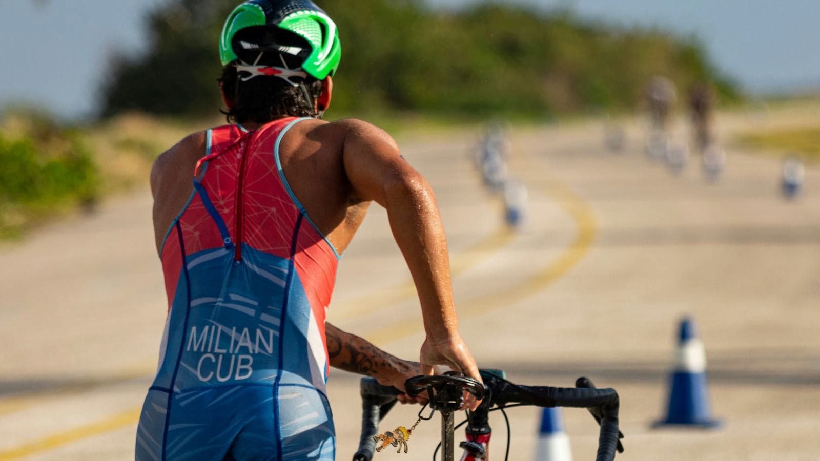 beginner triathlete preparing for first race with swim bike and run equipment organized in transition area