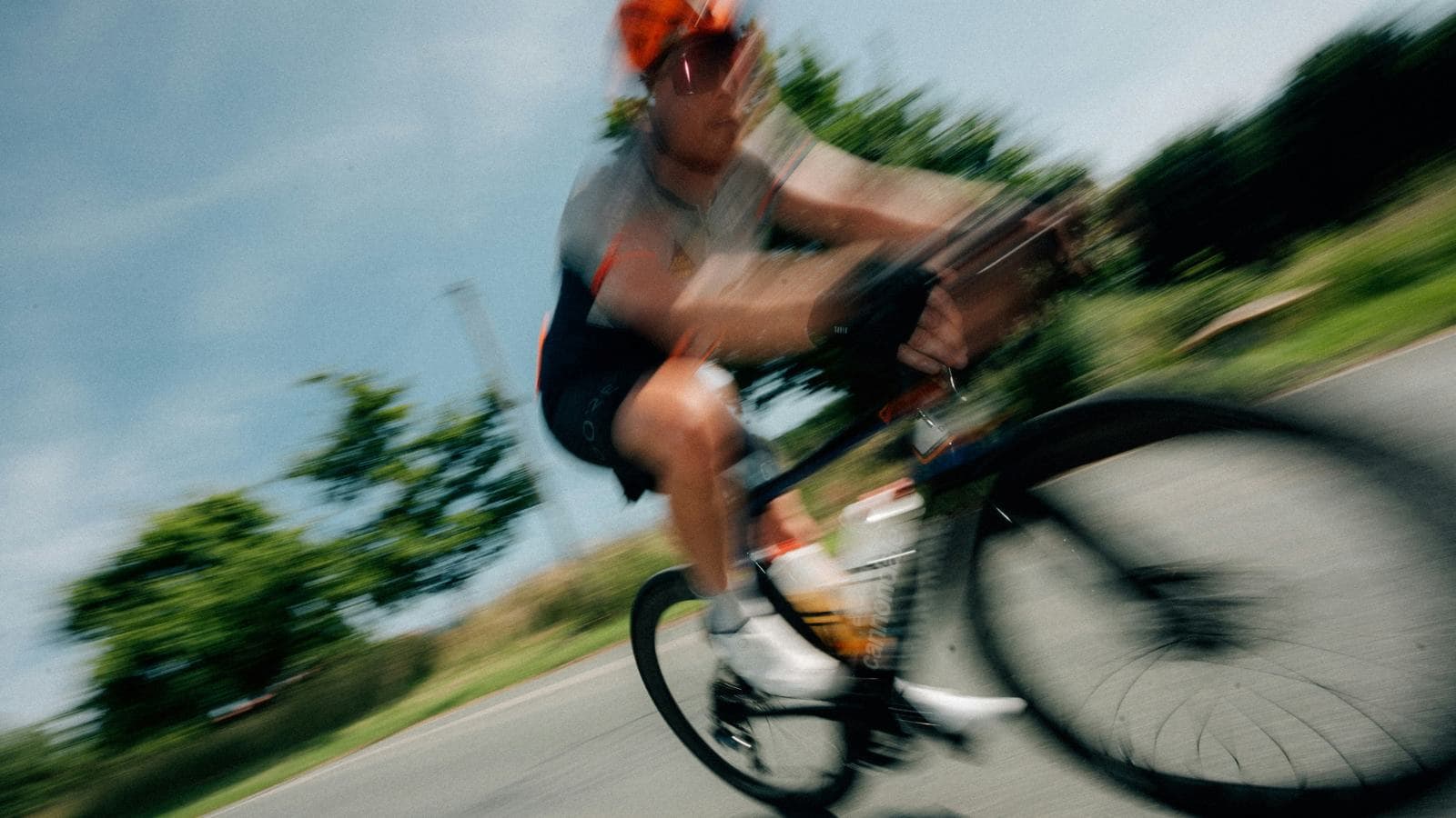 triathlete performing strength exercises and bike adjustments to prevent cycling related knee pain