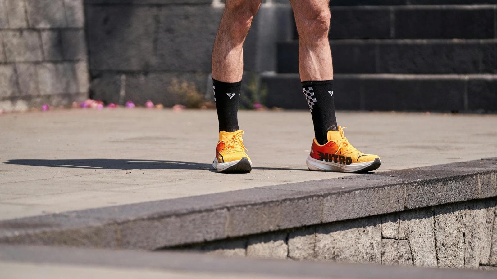 triathlete performing dynamic running drills before workout to improve form and prevent injuries