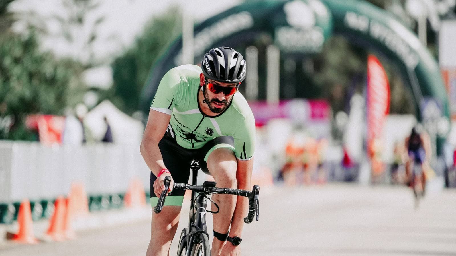 triathlete struggling with jelly legs during bike to run transition in triathlon race