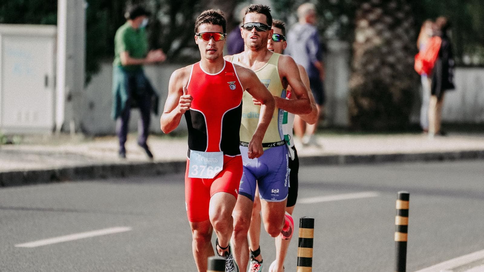 triathlete feeling emotional and fatigued after completing major race and reaching finish line